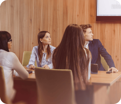 large-team-people-is-working-one-table-laptops-tablets-papers-background-large-tv-set-wooden-wall